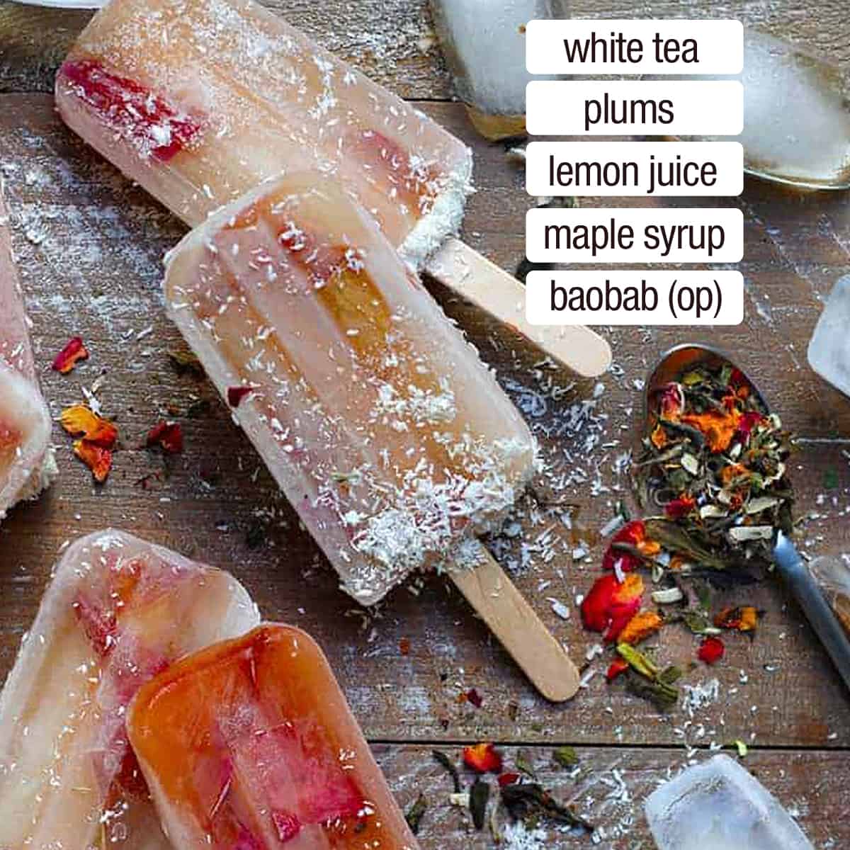 overhead view of white tea and plum popsicles with ice cubes