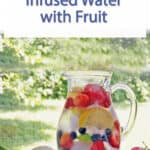 a pitcher of water with fruit