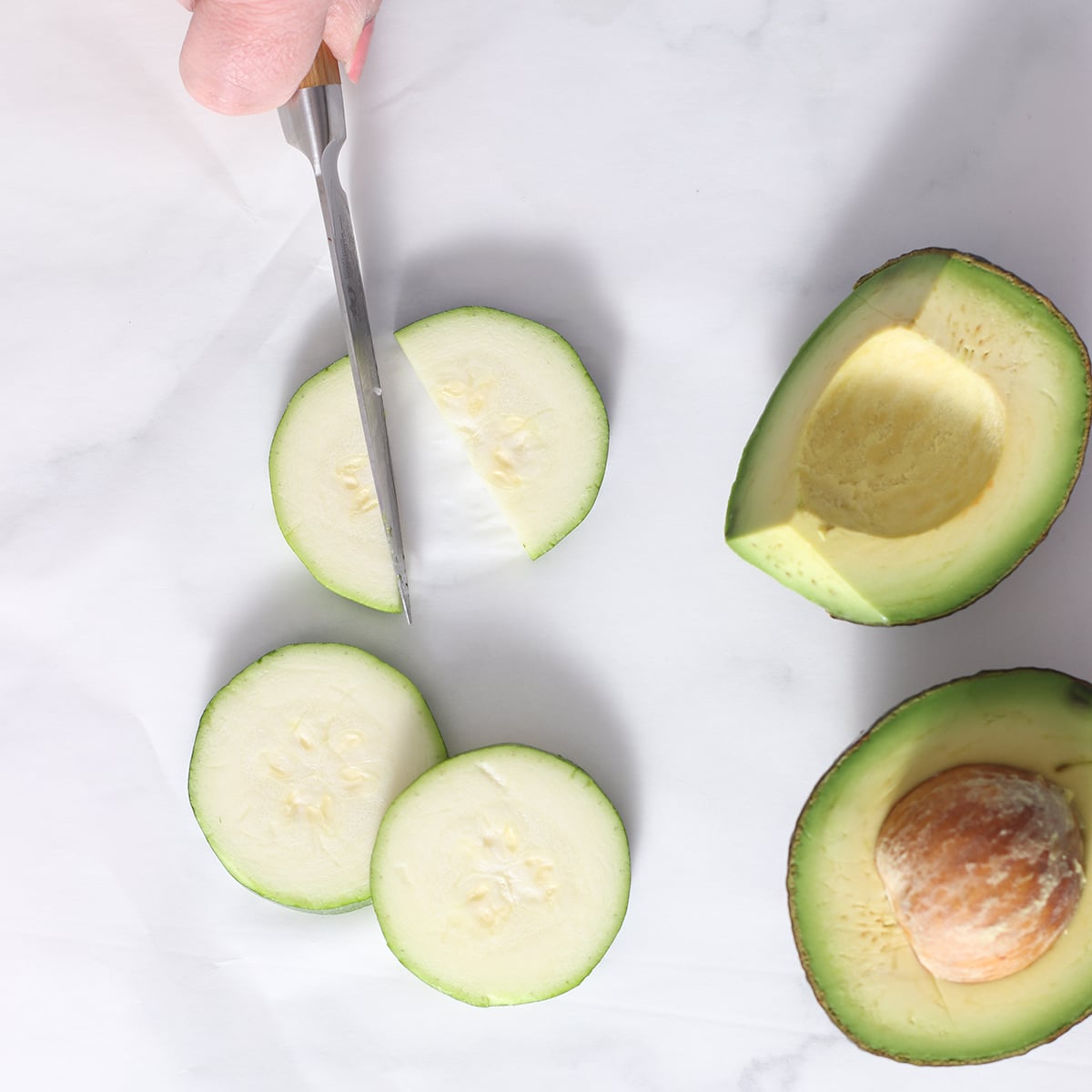 chopping zucchini for smoothie.