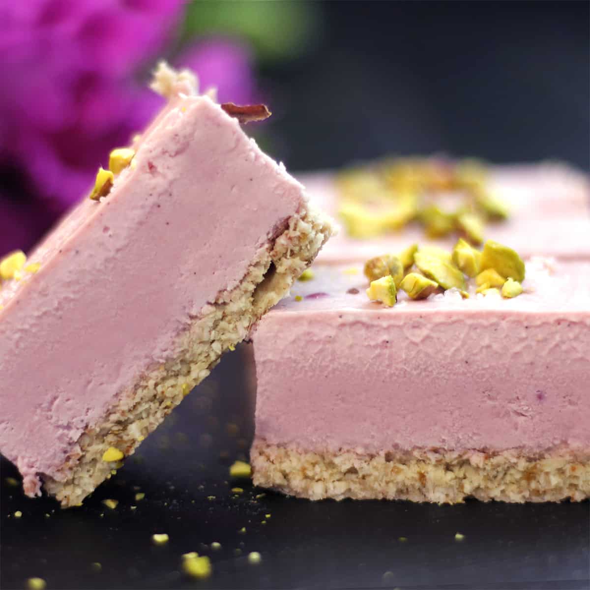 pink vegan cheesecakes on an angle.