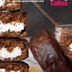 Chocolate cake rounds with cream inside, sliced and stacked with black background.