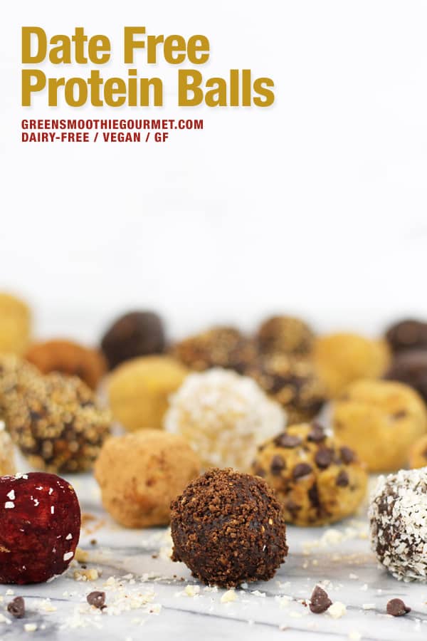 A collection of date free chickpea and oats protein balls on a marble board.