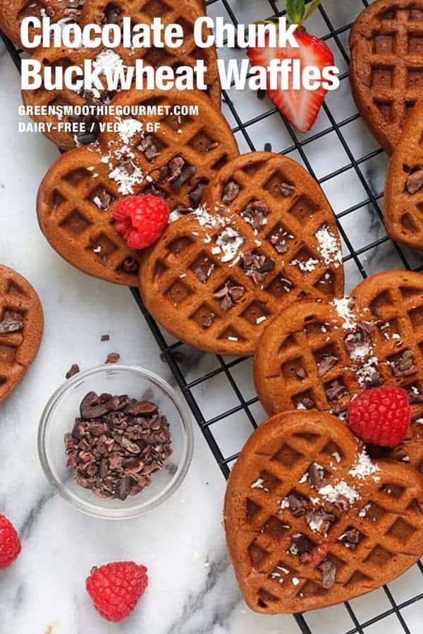 Heart buckwheat waffles on a cooling rack with fruit.