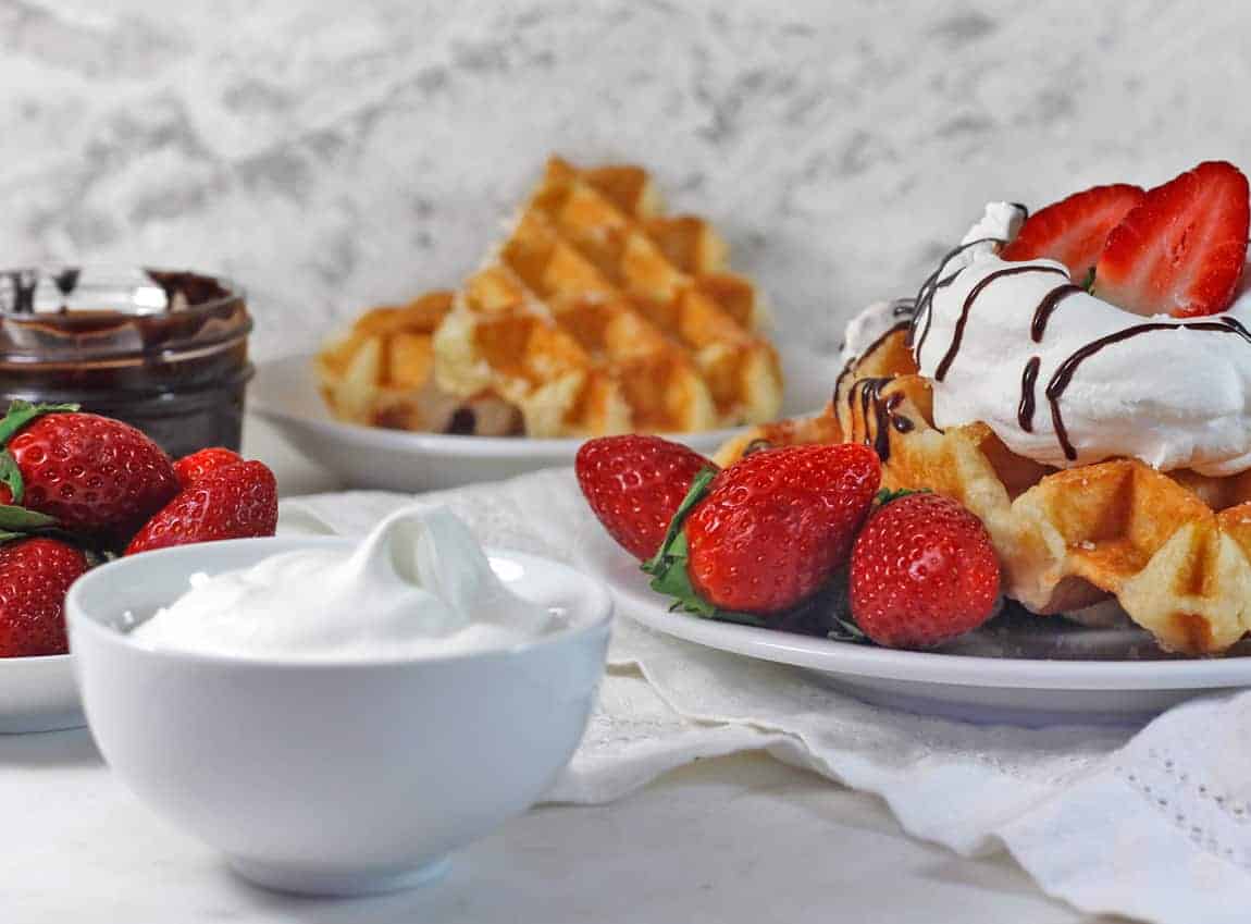 Straight on view of Simple Weight-Loss Aquafaba Blender Waffles on a white dish.
