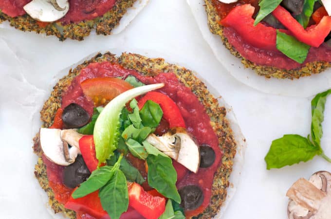Protein cauliflower pizza crust on a marble board.
