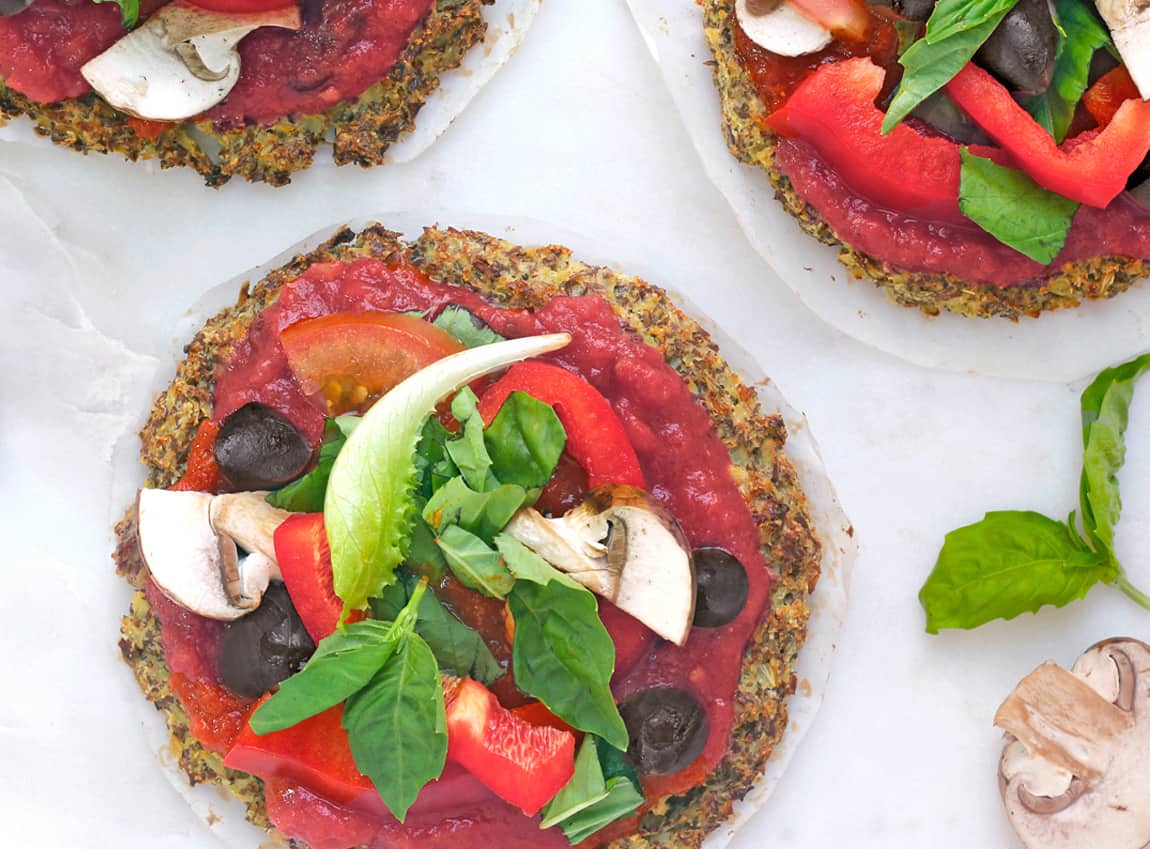 Protein cauliflower pizza crust on a marble board.