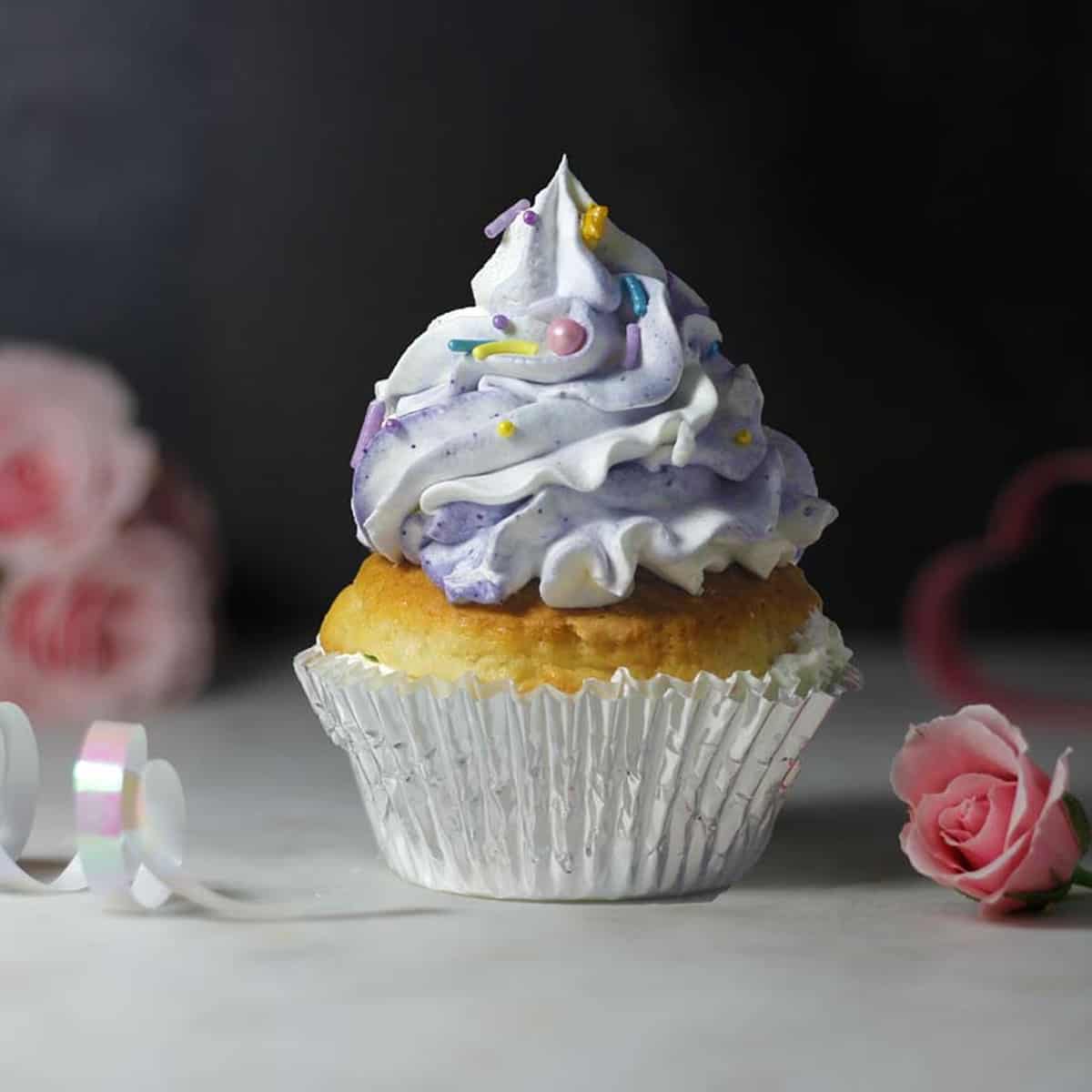 a cupcake with cashew cream whipped topping