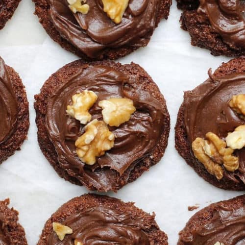 Crispy Chocolate Chip Cookies (vegan, double chocolate) in rows on a white table.