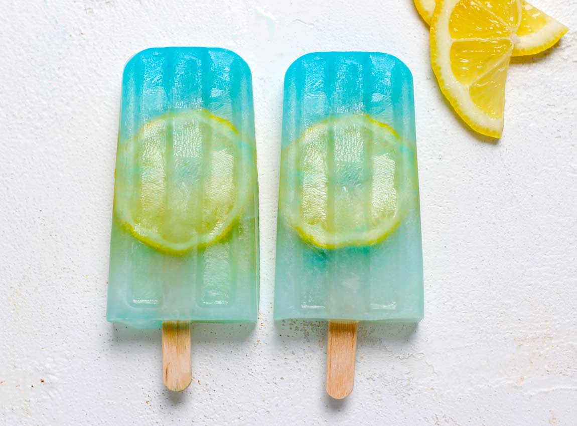 lemon popsicles that are blue with a lemon peel