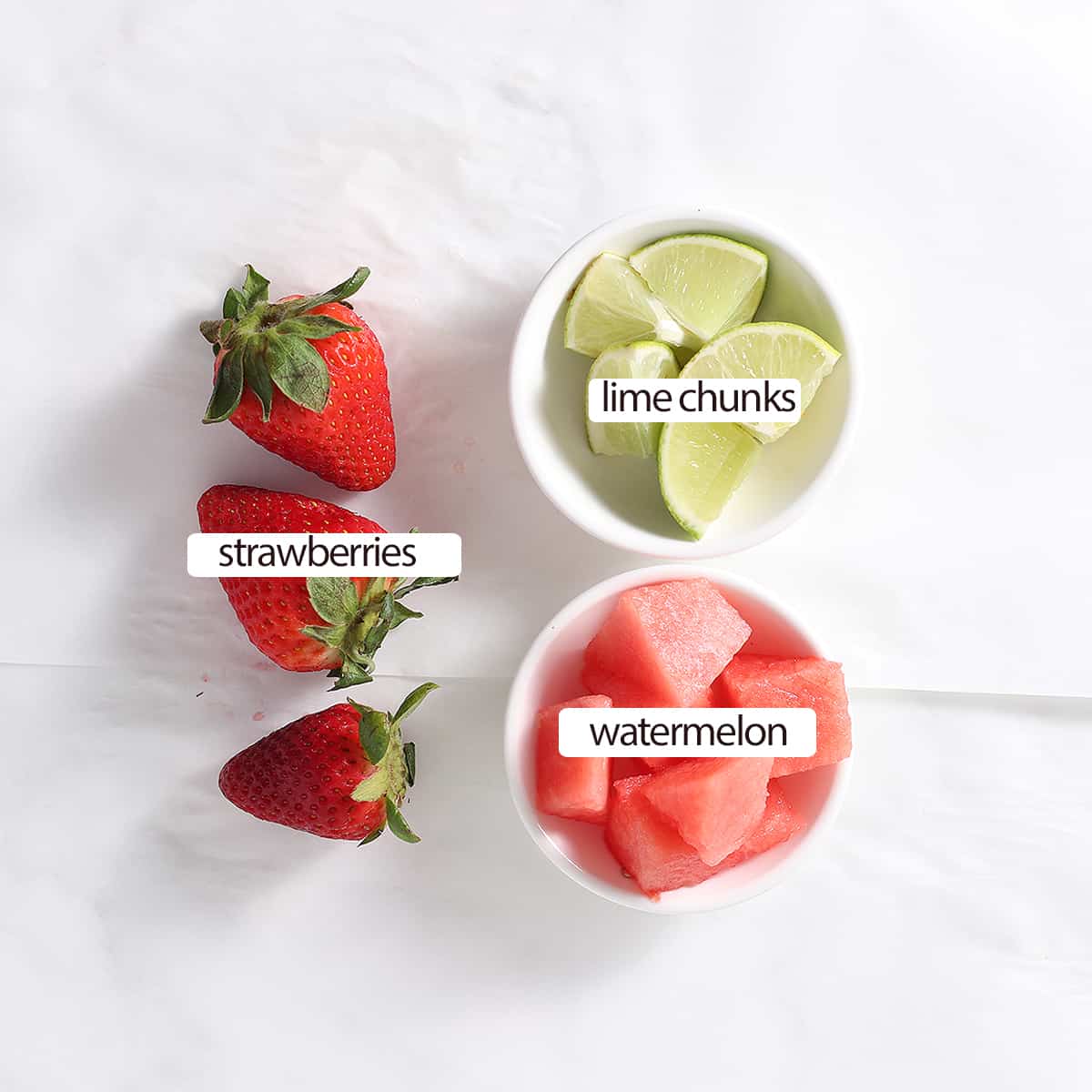 lime chunks and watermelon in bowls