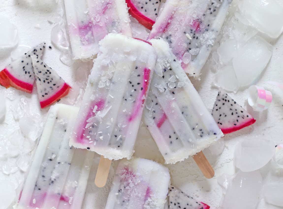 Dragonfruit Pina Colada Popsicles overhead on a board