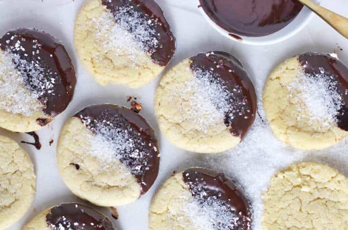 Overhead view of vegan sugar cookies coated in chocolate.