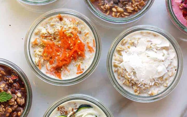 overhead of 7 overnight oats recipes topped with carrots, chocolate chips and zucchini