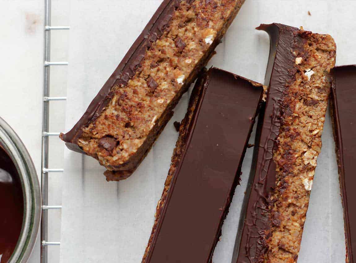 Homemade granola bars on a white board.