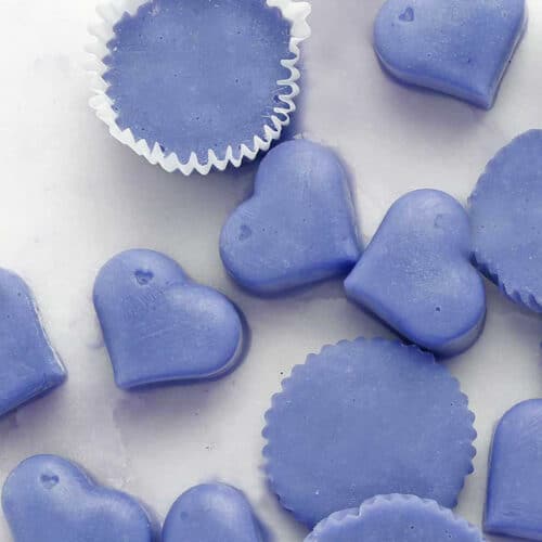 lemon butterfly pea flower protein bites on a table.