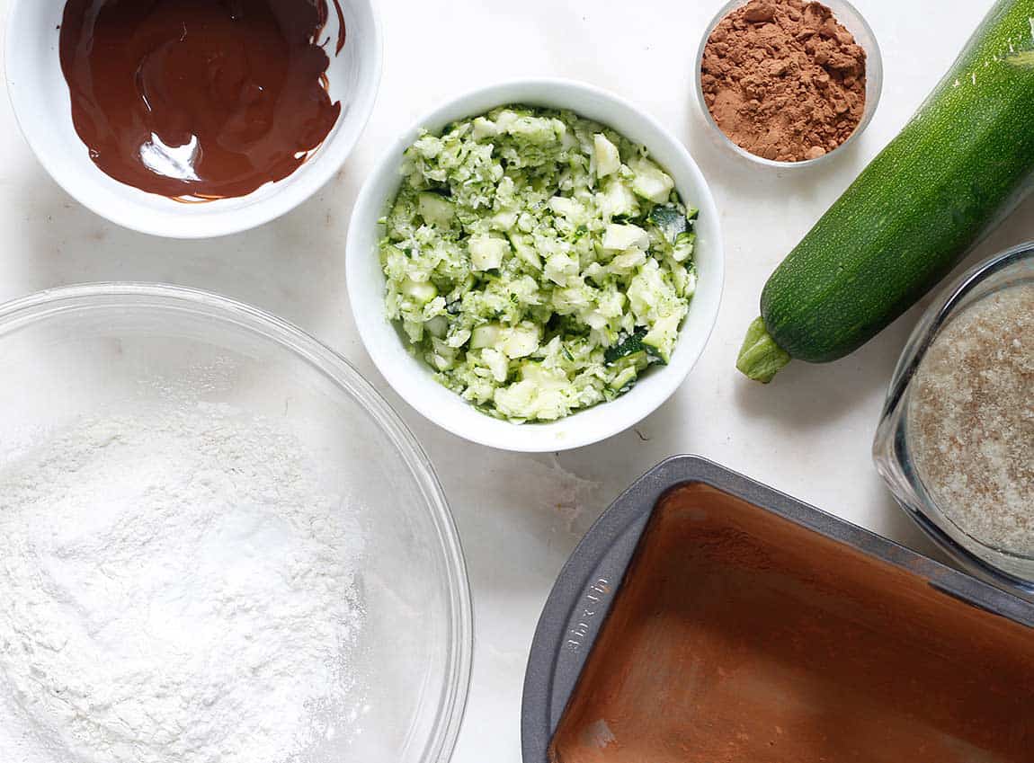 Ingredients for a dark chocolate zucchini batter for bread or cupcakes.