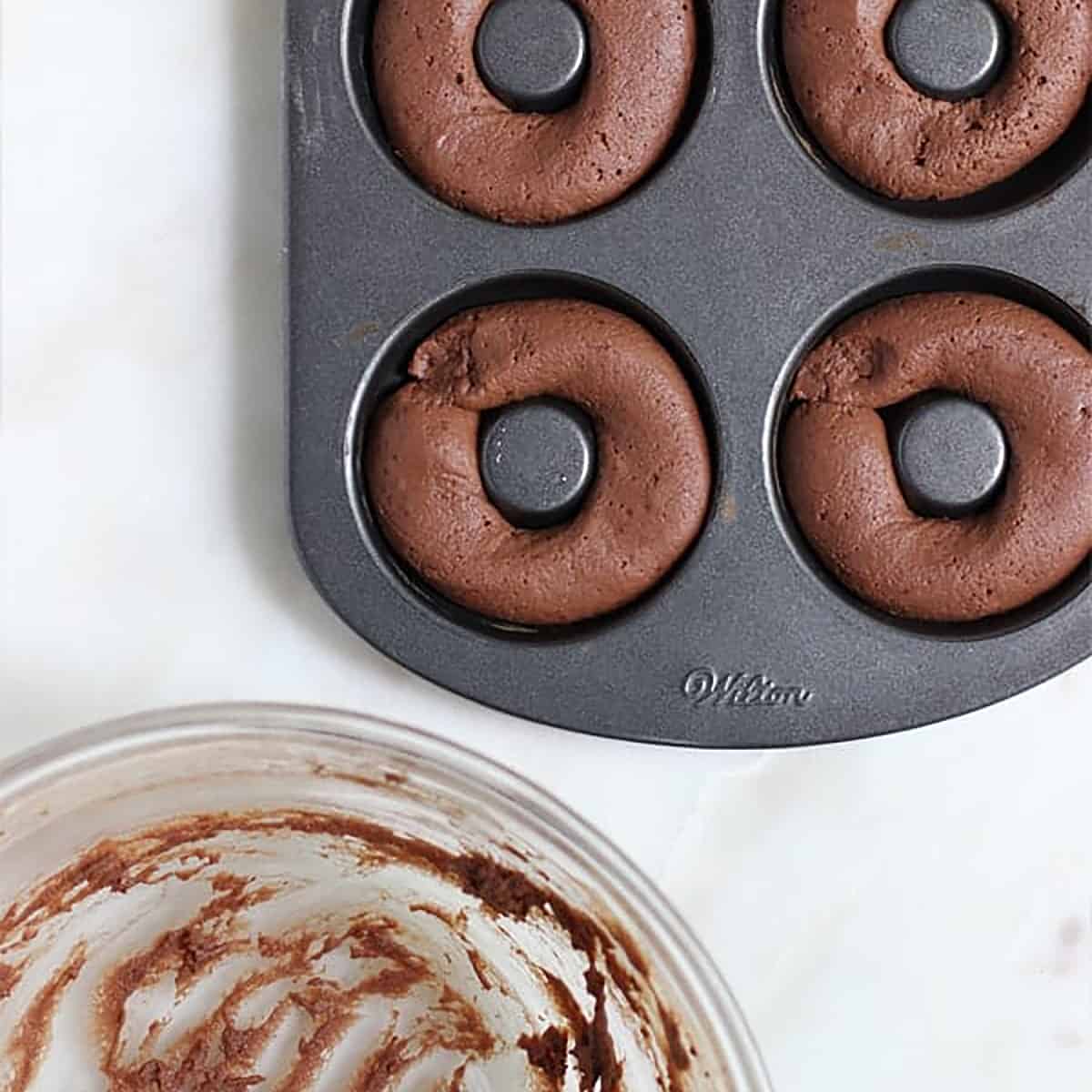 breakfast donuts in a donut pan to be baked.