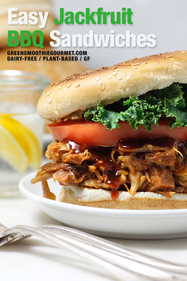 Jackfruit BBQ sandwich in a bun with tomato and kale in a toasted bun.