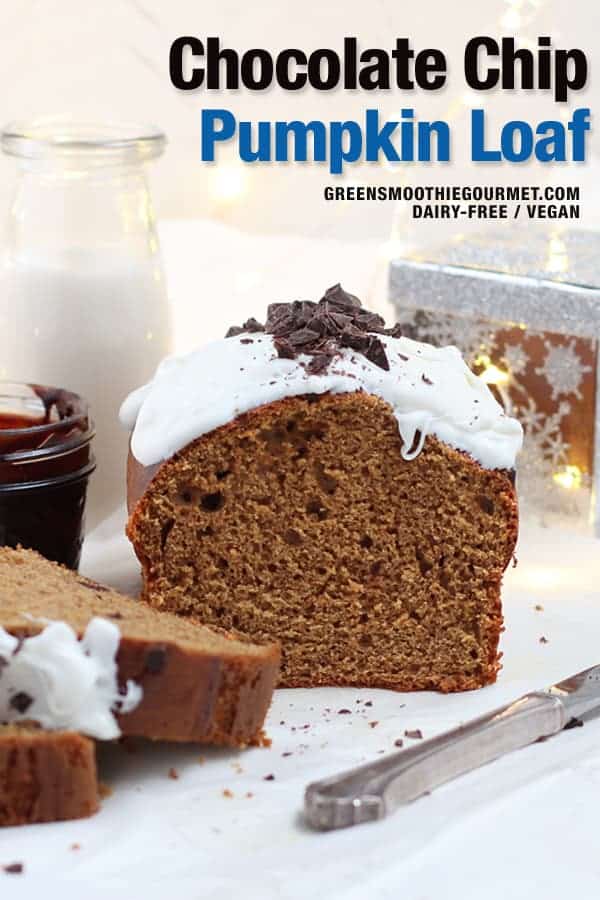 Straight on shot of sliced chocolate chip pumpkin loaf with icing on top and a silver box to the right.