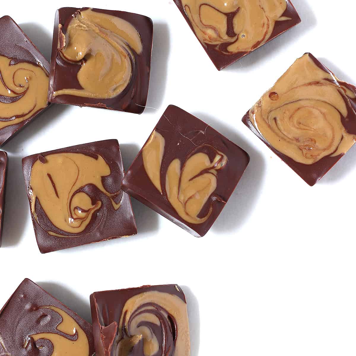 close up of marbled chocolate peanut butter fudge on a table.