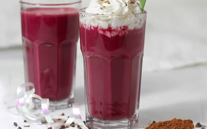 a glass of chocolate beet smoothies