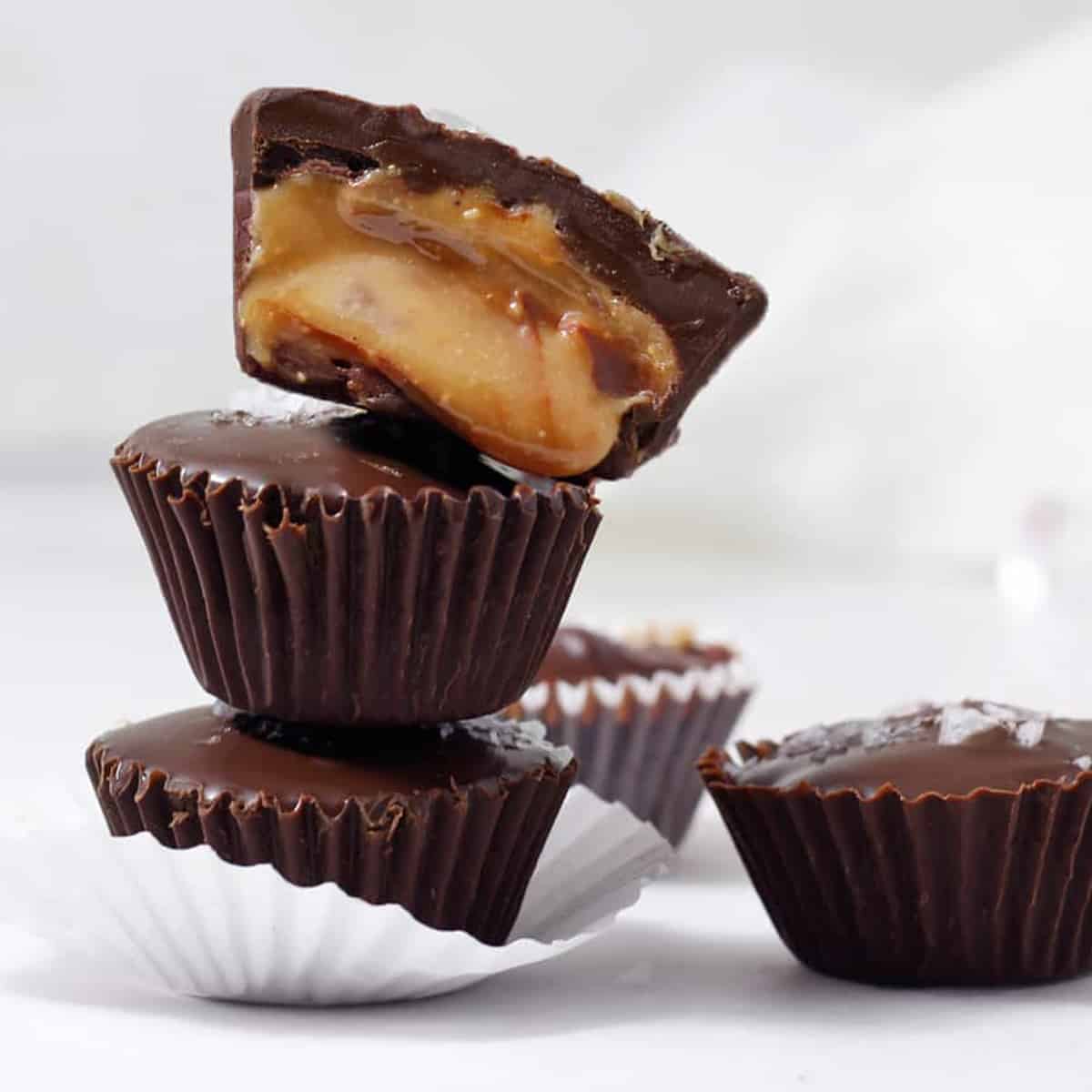 a tower of three rolo candy cups with top one slice open