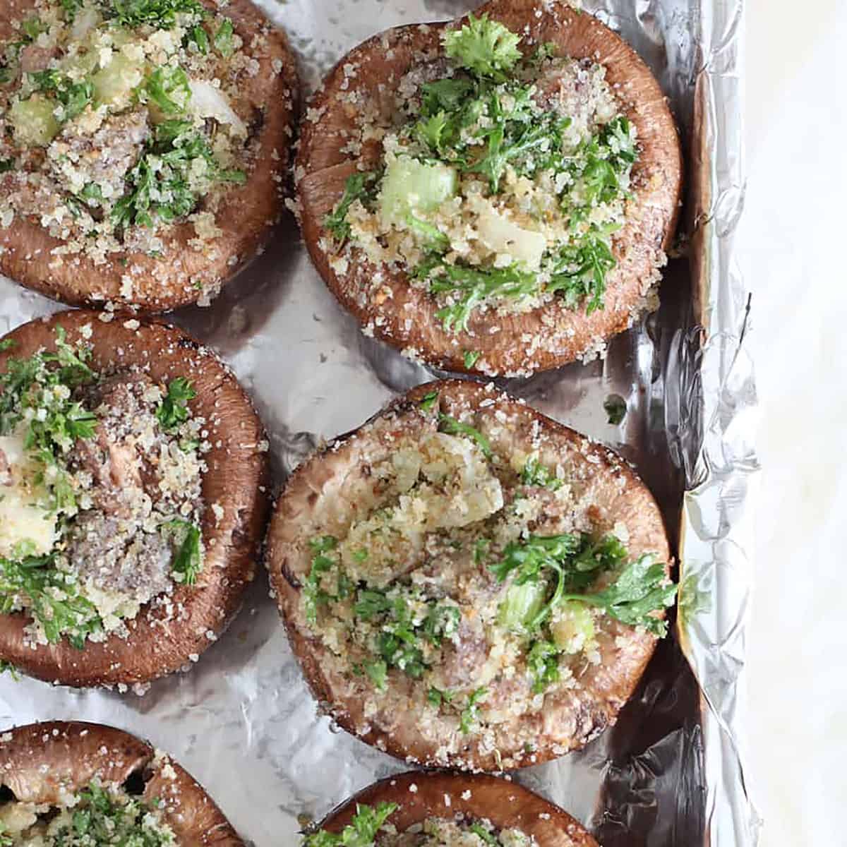 stuffed mushrooms in a pan ready to cook.