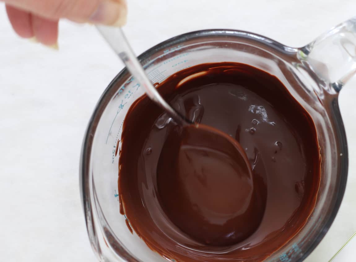 Melted chocolate in measuring cup.