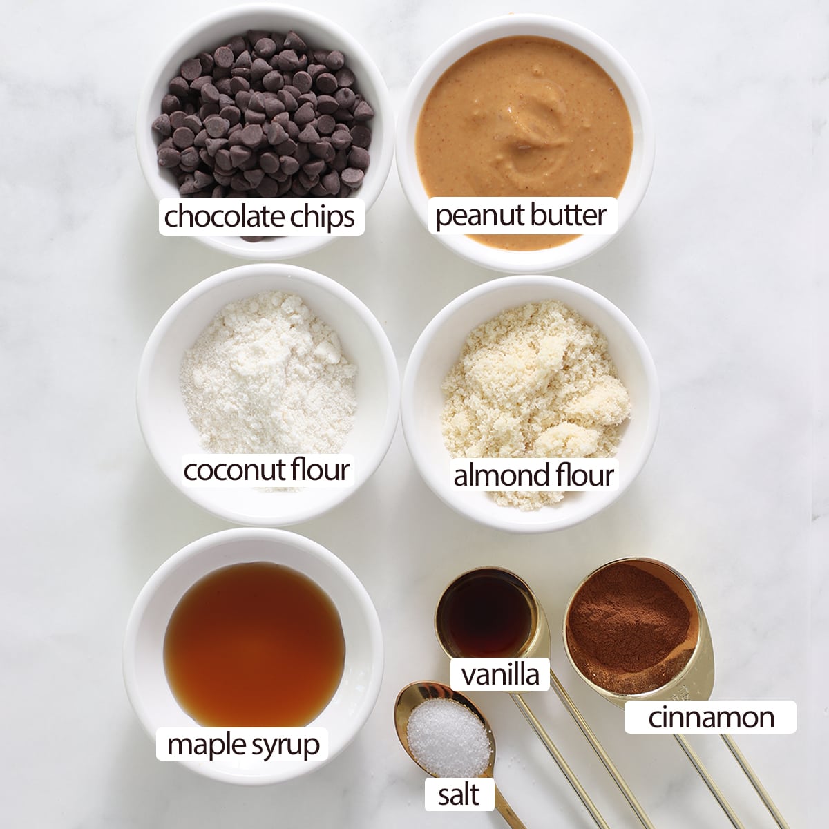 overhead of ingredients for peanut butter protein bars with labels.