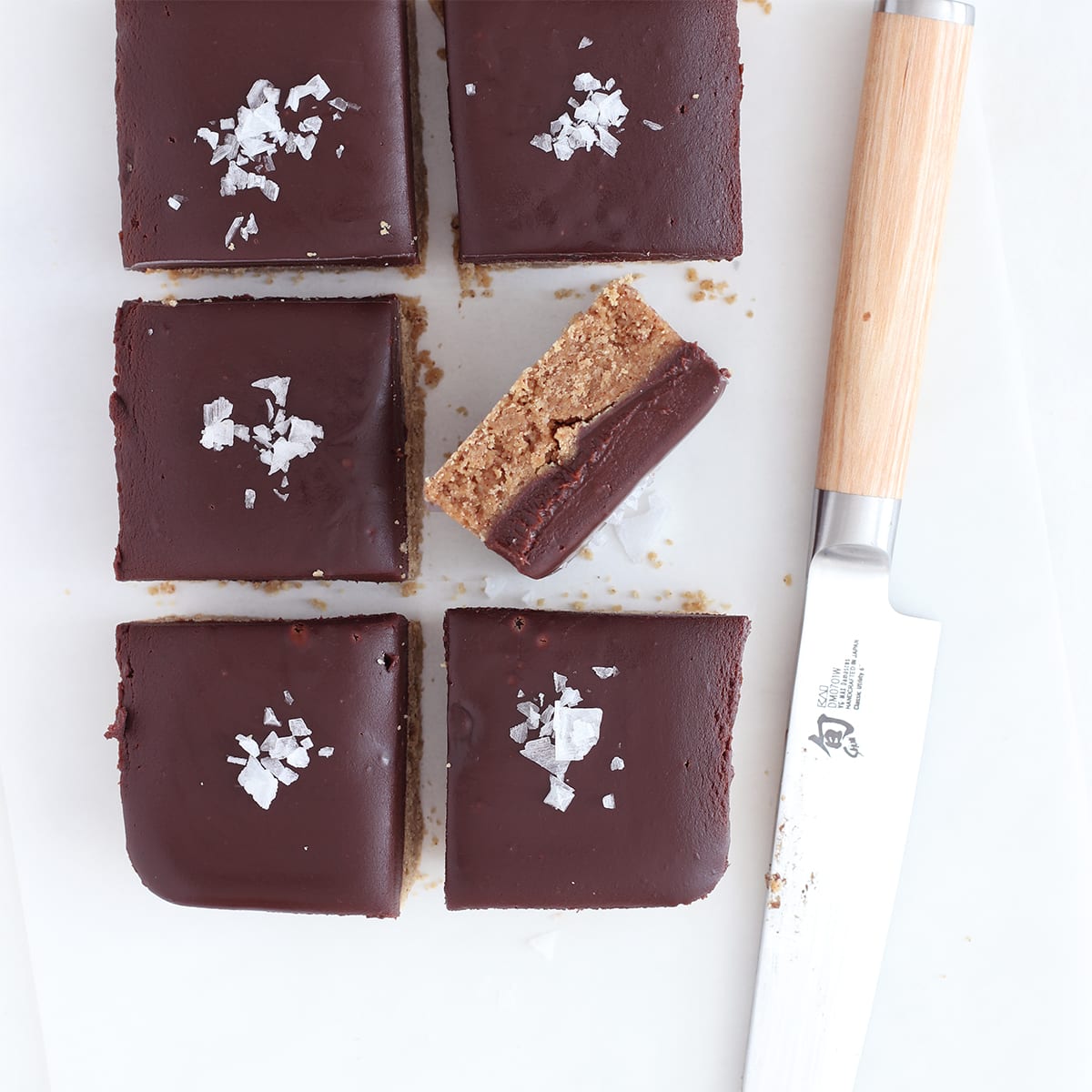 peanut butter protein bars cut with a knife.