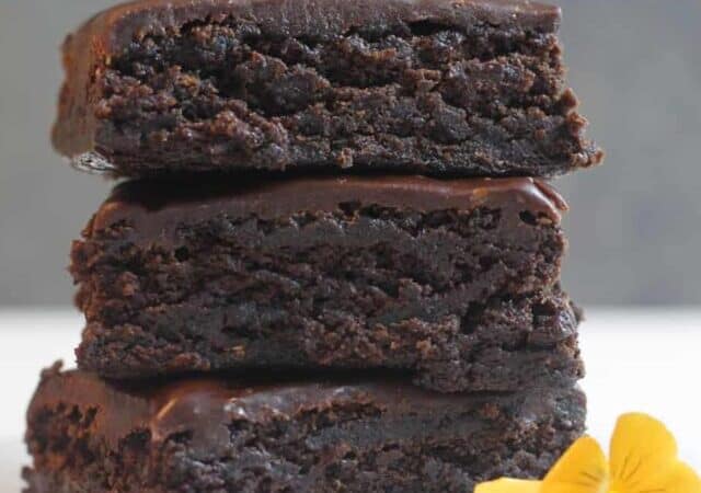 stack of brownies with a yellow flower