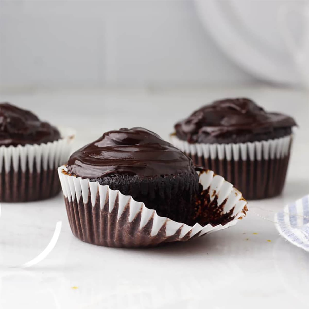 hazelnut cupcakes with paper pulled off.