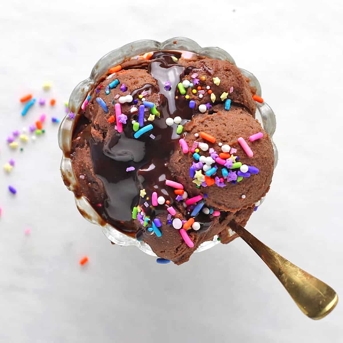 overhead shot of brownie batter in a bowl with spoon