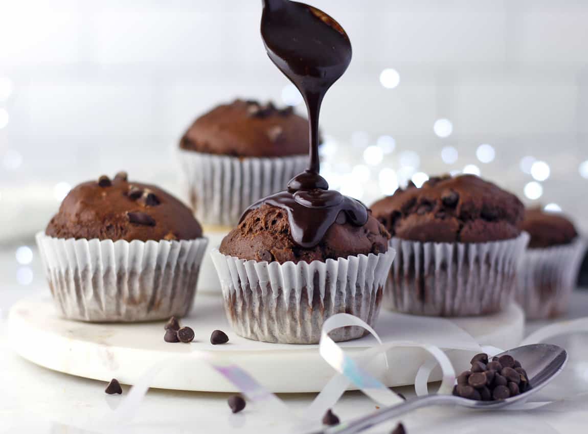 double chocolate muffins on a board.