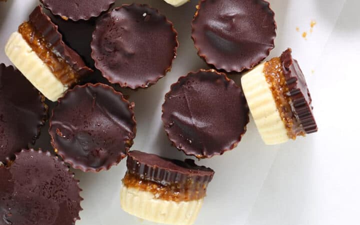 overhead view of twix cups spilling on a white table