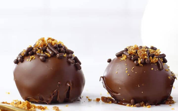 two chocolate pralines on a table