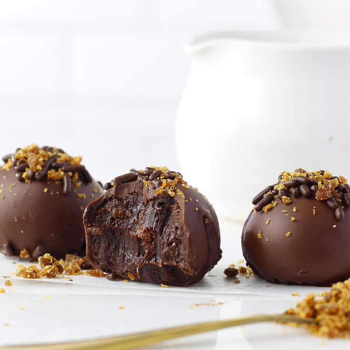 a chocolate praline with a bite out