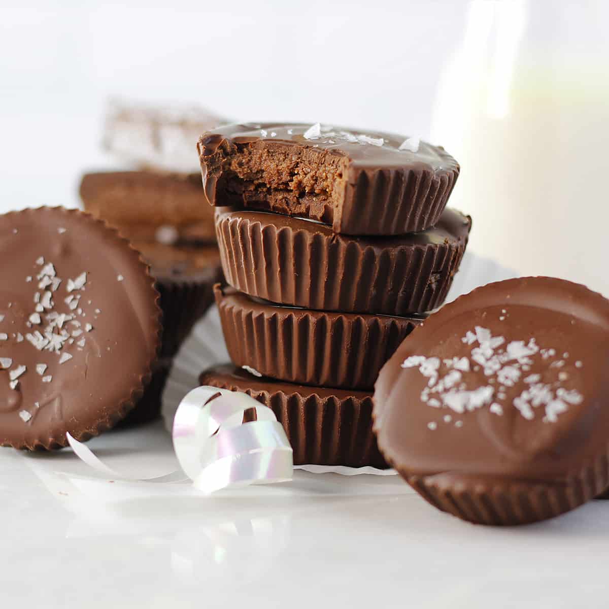 stack of four fudge cups with a white ribbon