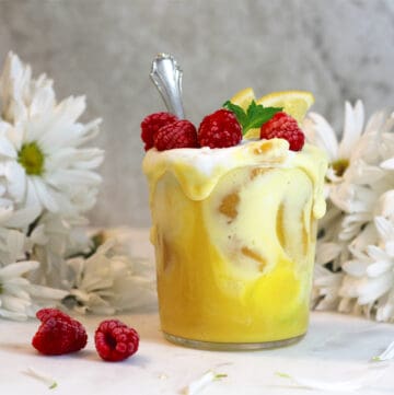 mango smoothie with raspberries on top