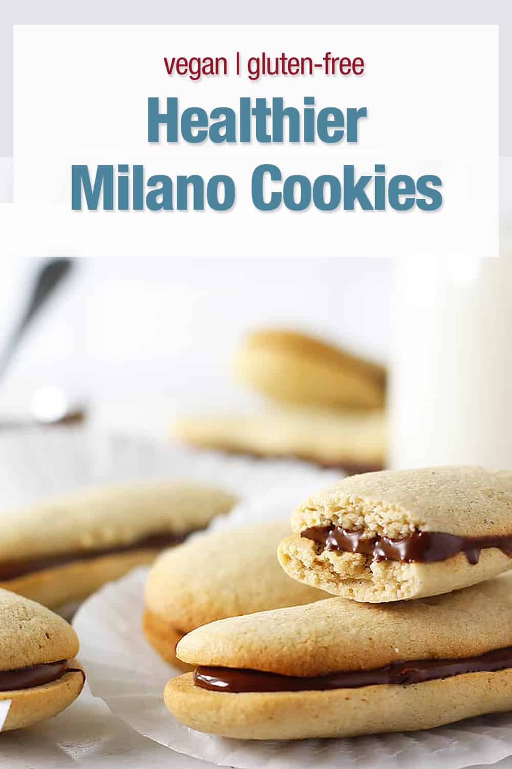 milano cookies stacked and one with a bit
