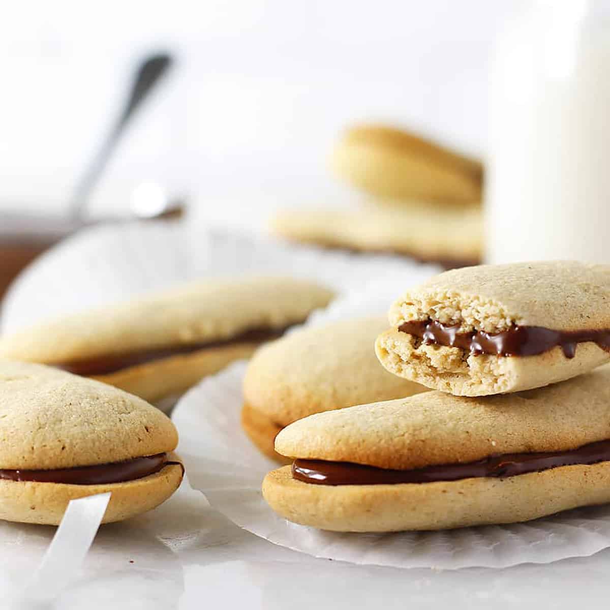 milano cookies stacked and one with a bite