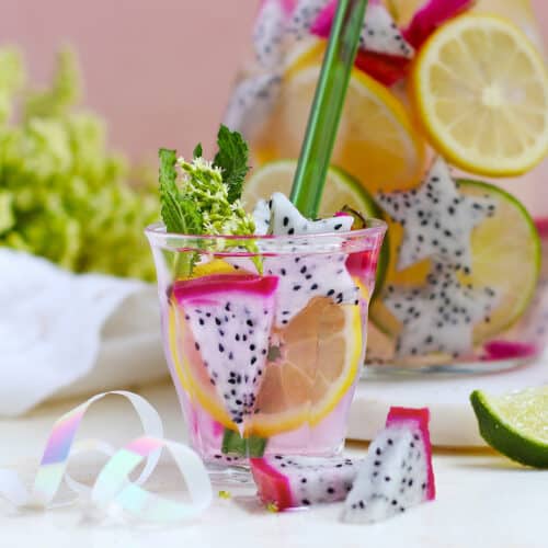 glass of dragon fruit water with a straw
