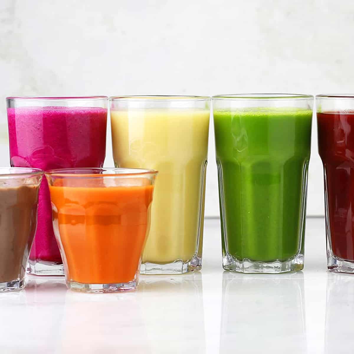 a row of smoothies in different colors and flavors