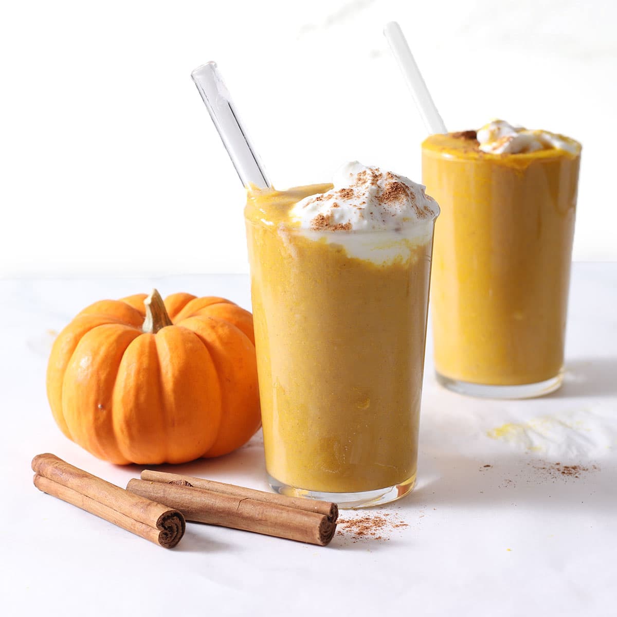 two glasses of pumpkin smoothies.
