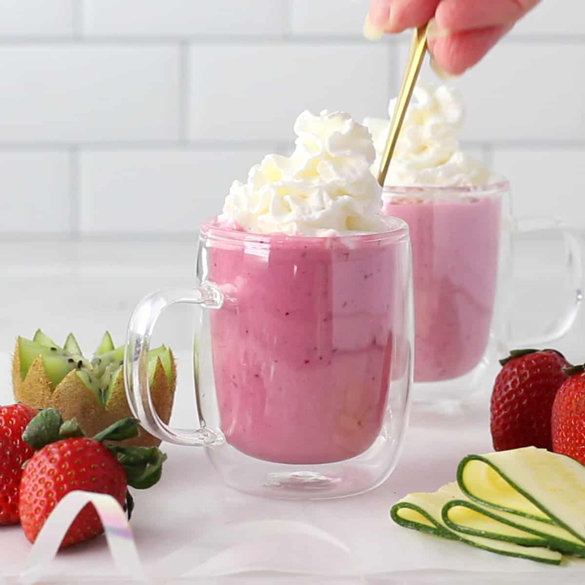 mug with strawberry smoothie with whipped cream