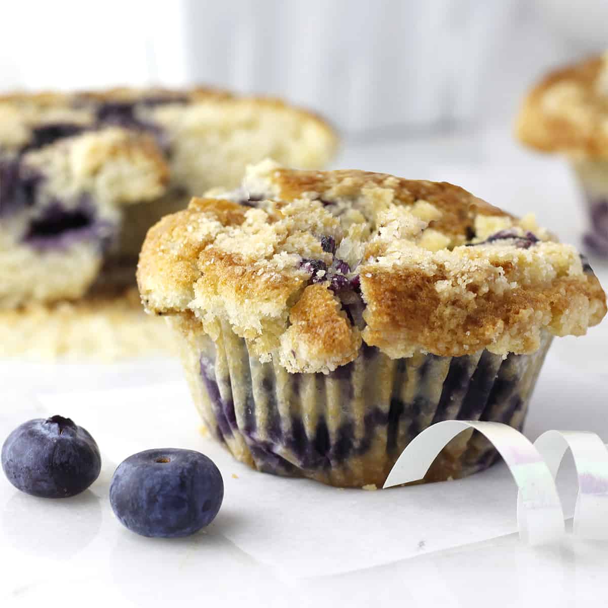 a blueberry muffins with two blueberries