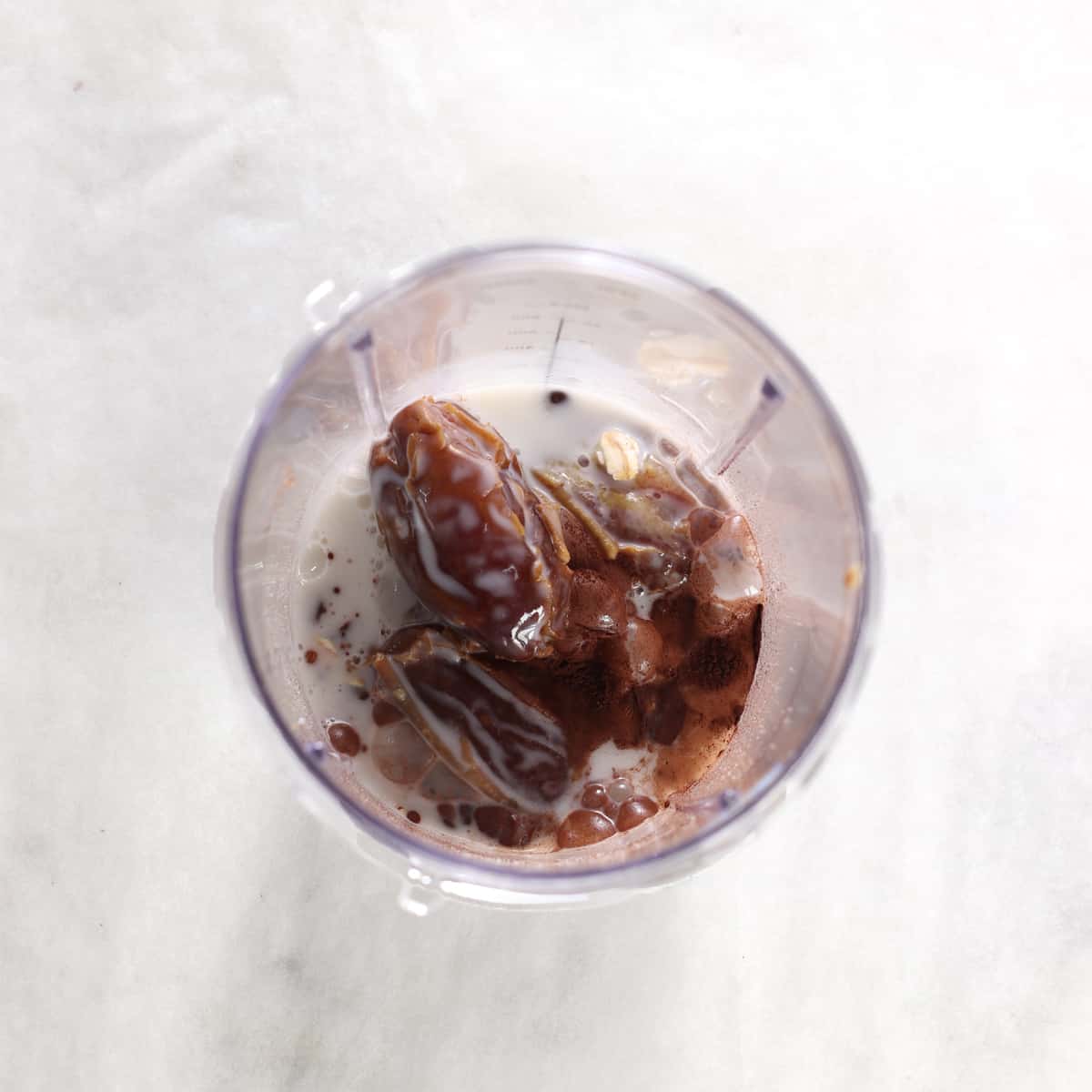 ingredients for chocolate peanut butter smoothie overhead shot