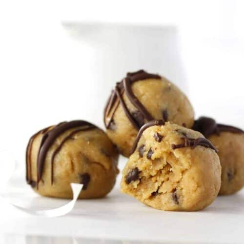 three cookie dough balls stacked on a table