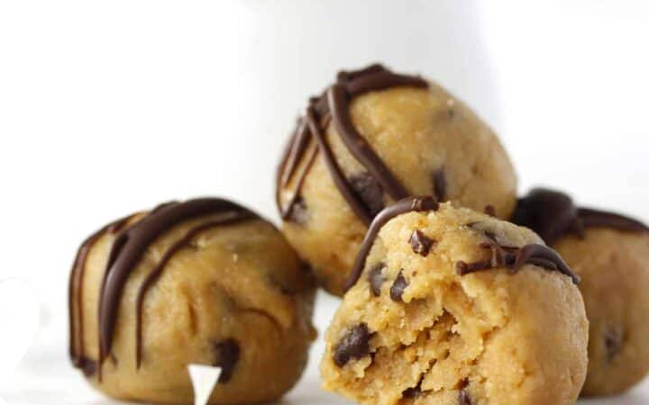 three cookie dough balls stacked on a table