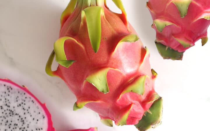 fresh dragon fruit with a dragon fruit sliced